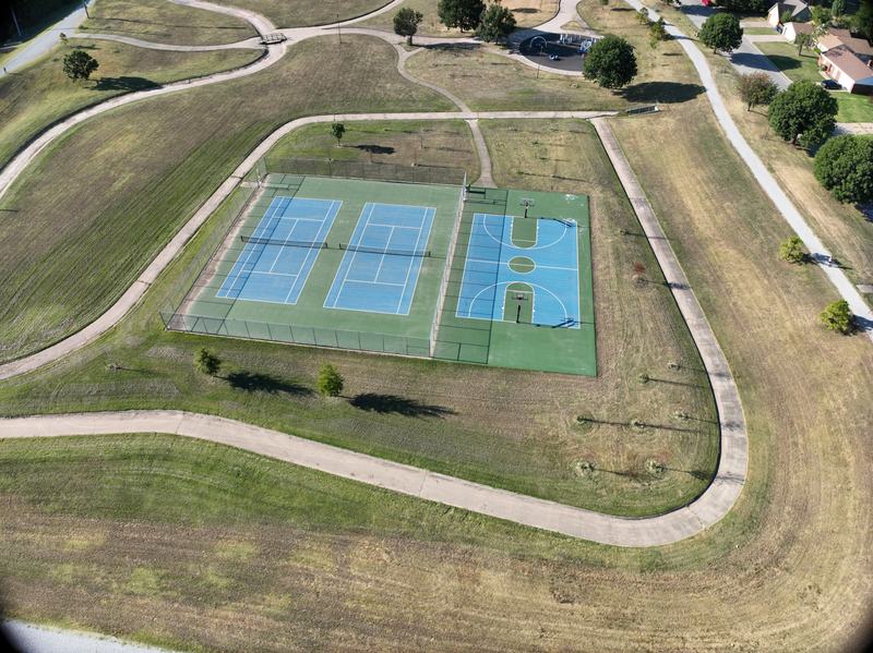 Aerial photograph of the blue courts and paths at Aaronson Park.